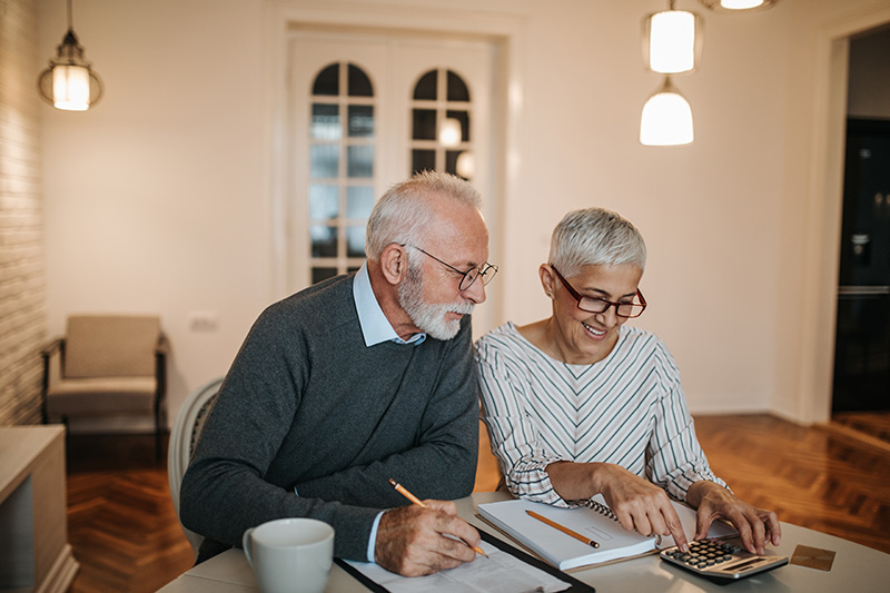 Retired Couple looking at Finances