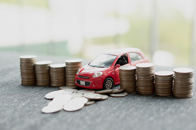 Model Car pushing over coin money